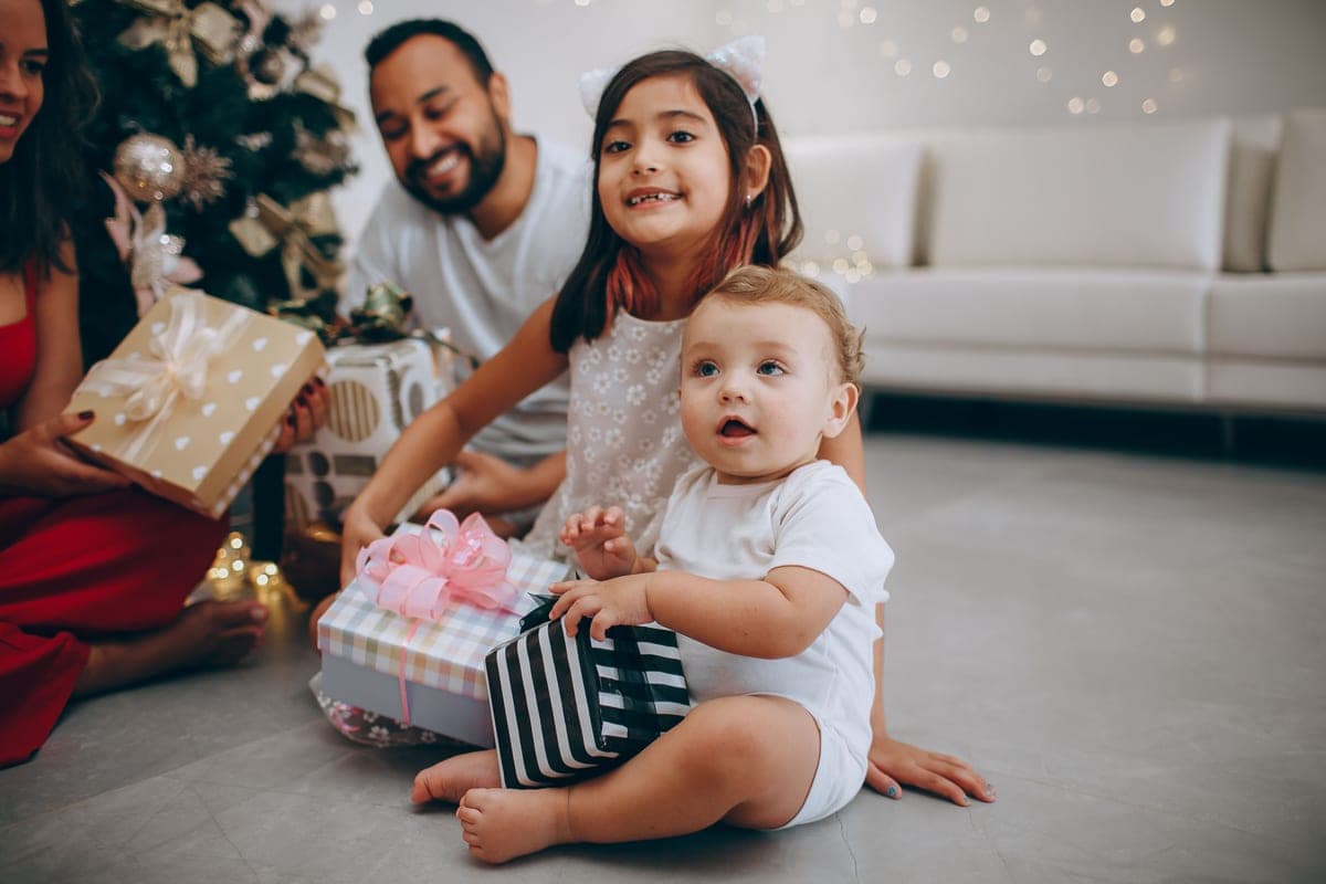 Children opening presents together