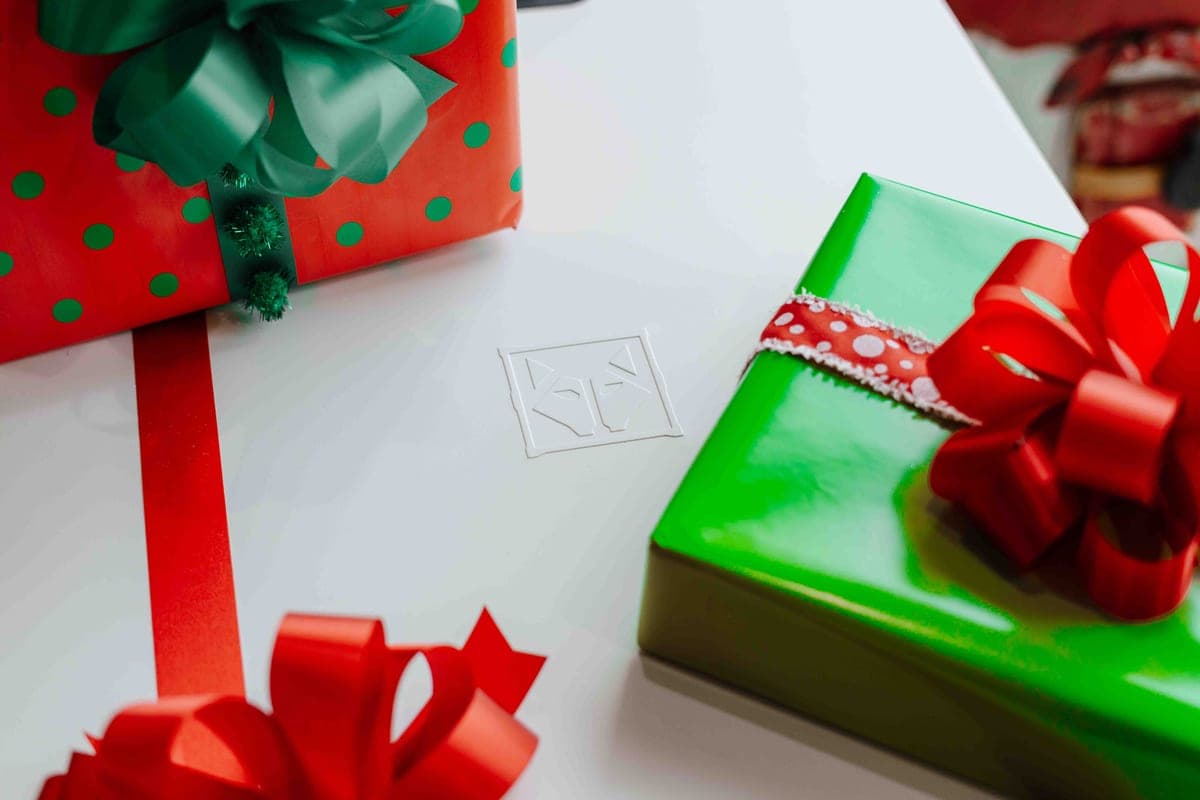 A wrapped gift beside a telescope