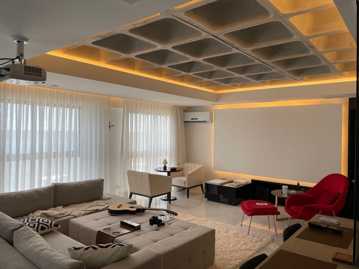 Galaxy-like light projected across a living room ceiling