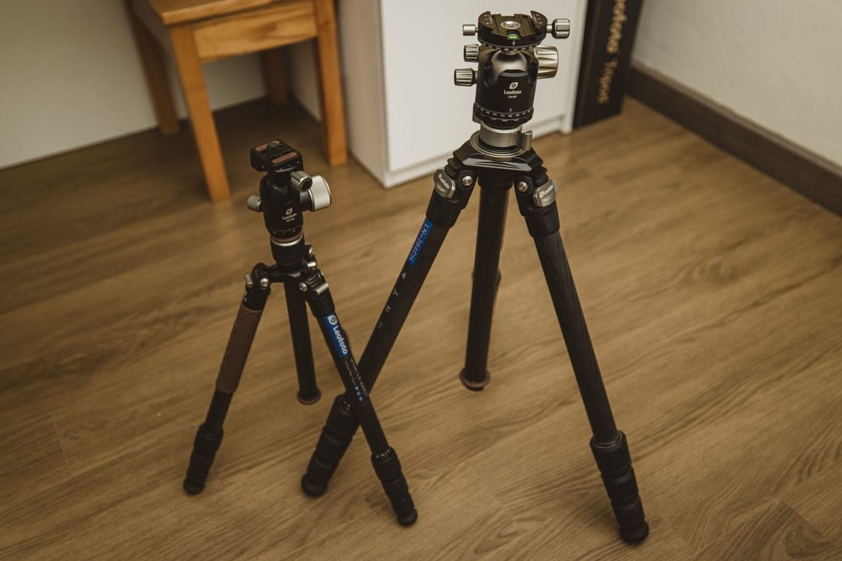 Tripod legs standing on grass in fading evening light