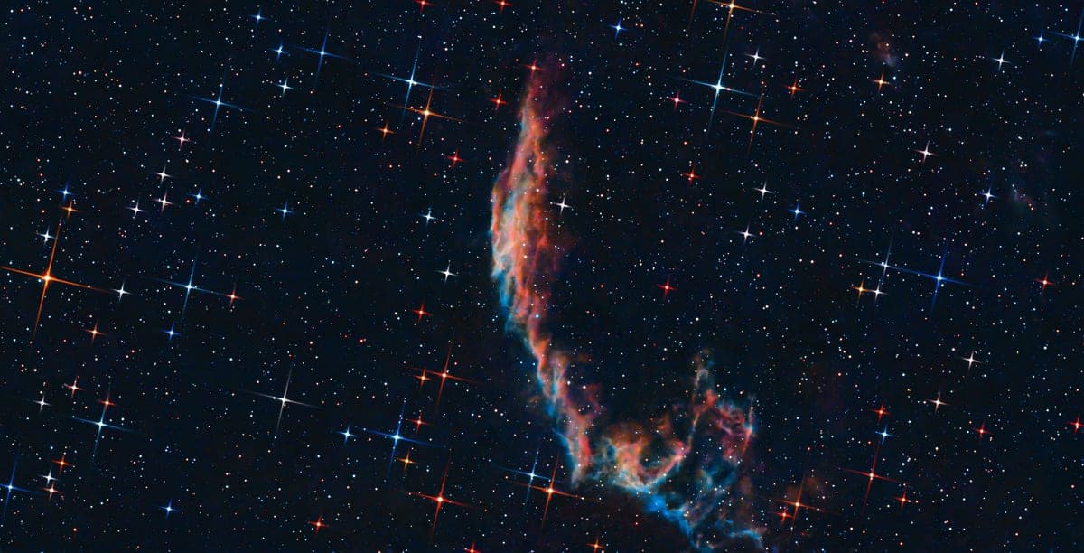 A bright nebula in a dense star field